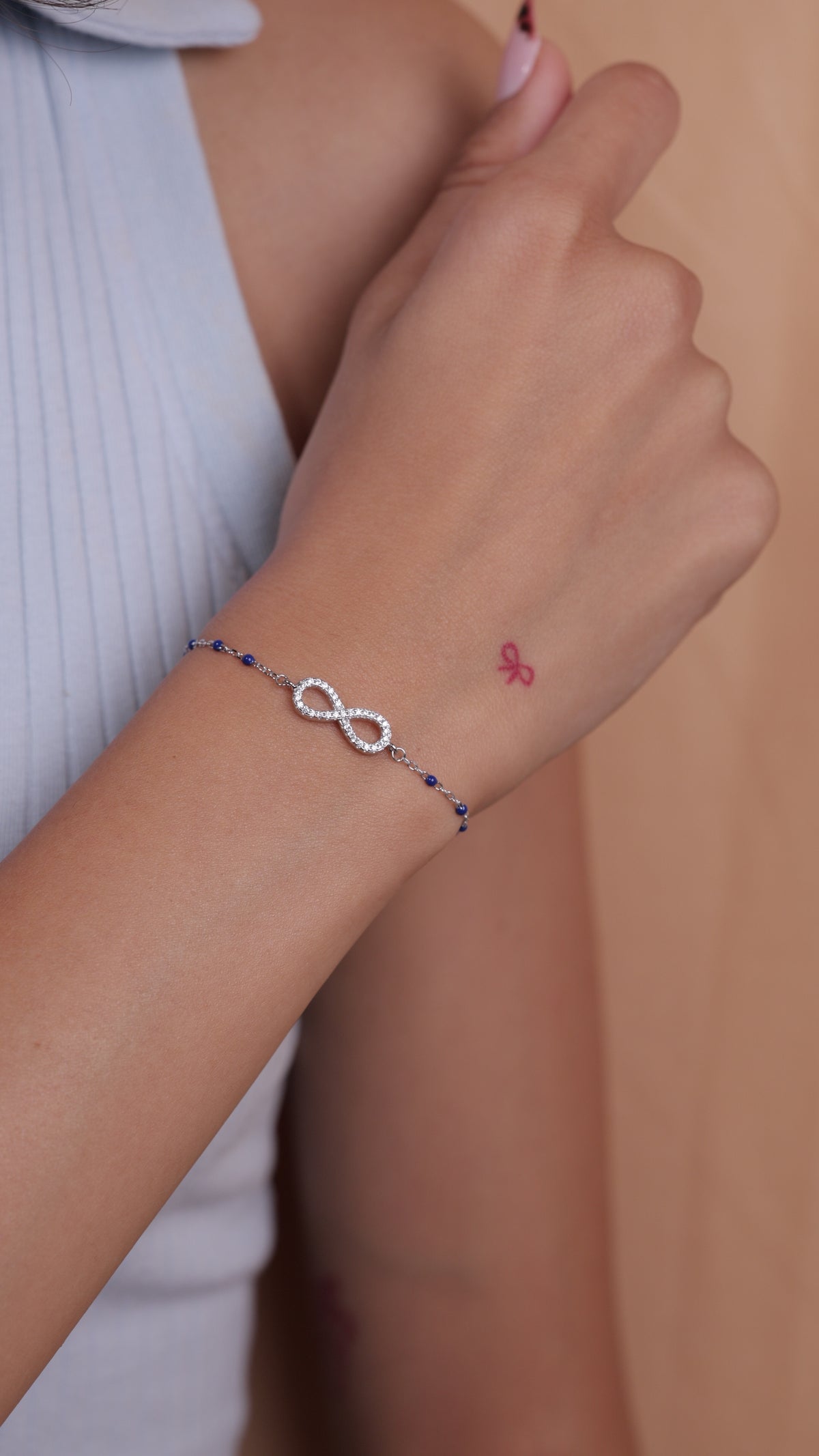 Infinity Charm Bracelet with Blue Beads